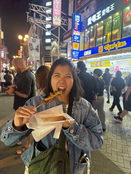 Jenny with a grilled skewer in Dotonbori, Osaka