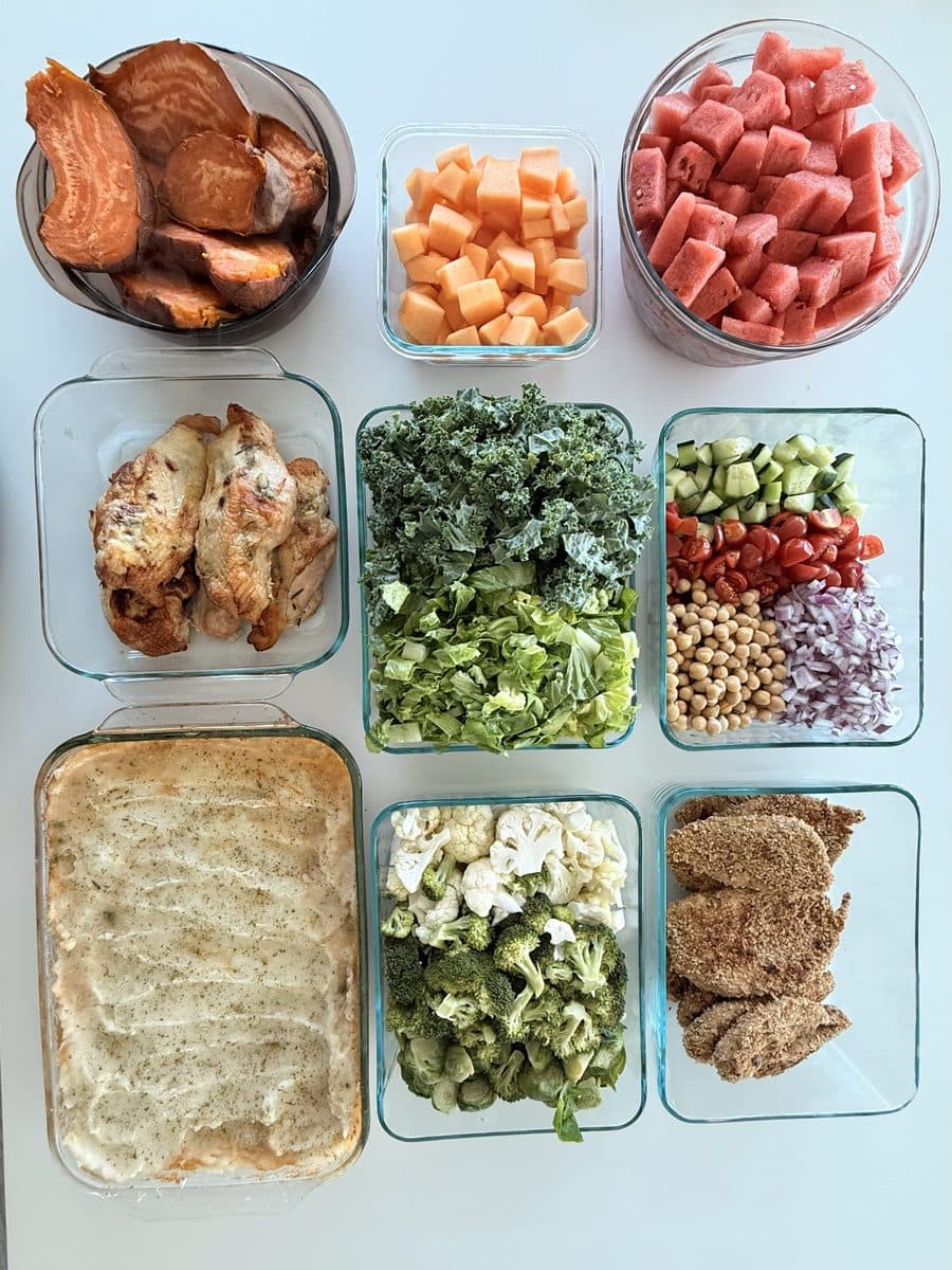 Prepped meals: roast chicken, greens, focaccia and cut fruit