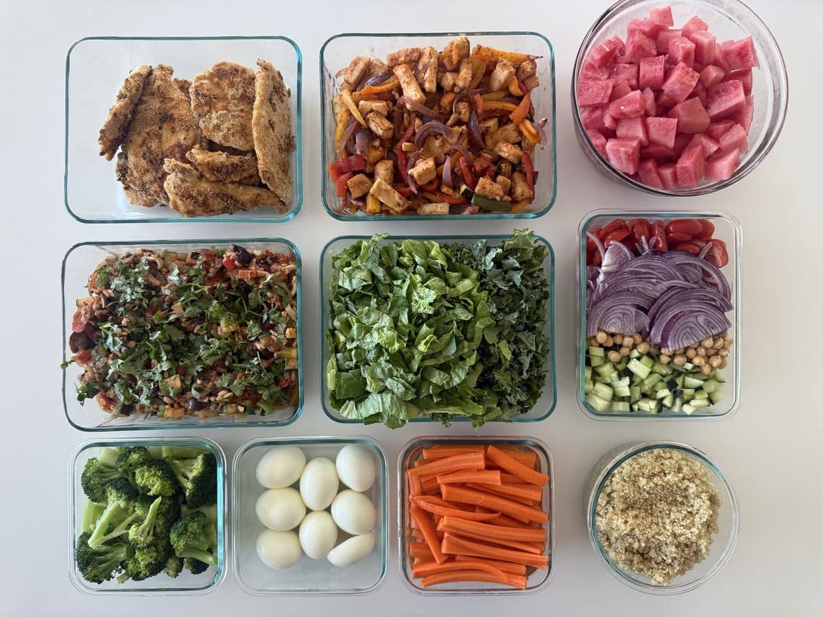 A week of prepped meals portioned into glass containers