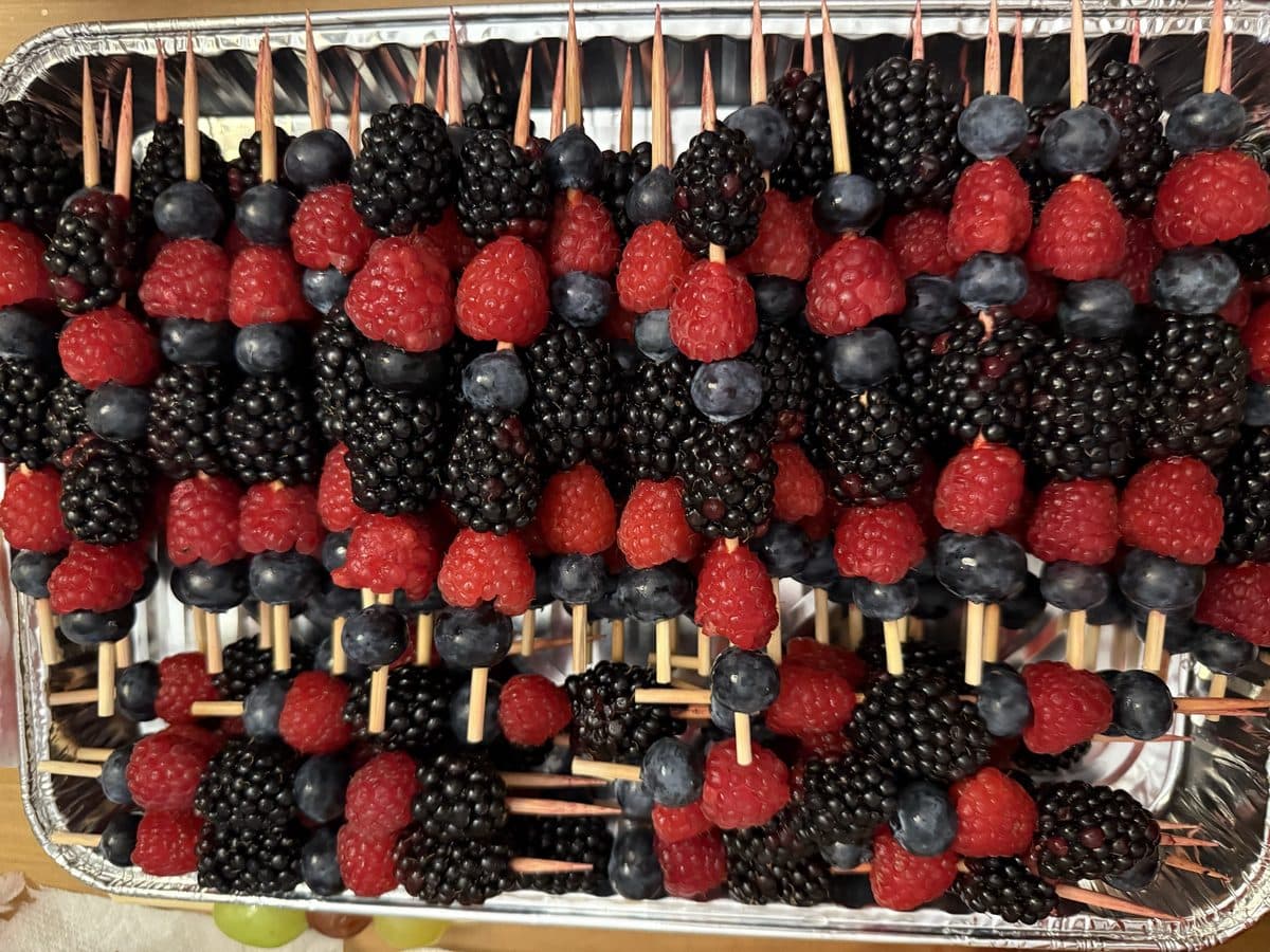A tray of berry skewers prepared for catering